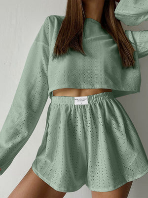Perforated crop top and short set in Matcha Green with a textured pattern.