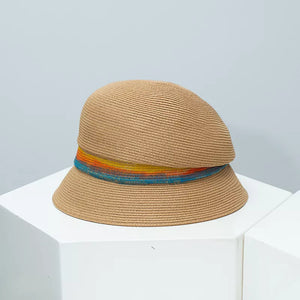 Chic straw cloche hat in Khaki with a vibrant rainbow band.