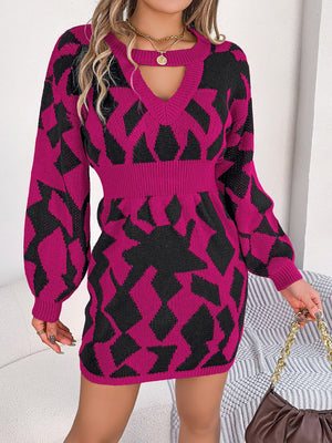 Geometric cutout knit mini dress in deep rose with black pattern, V-neck, long sleeves, and cinched waist.