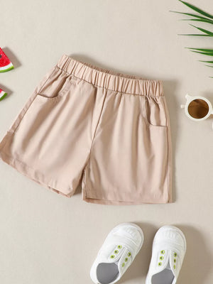 Baby shorts with elastic waist and pockets in beige cotton.