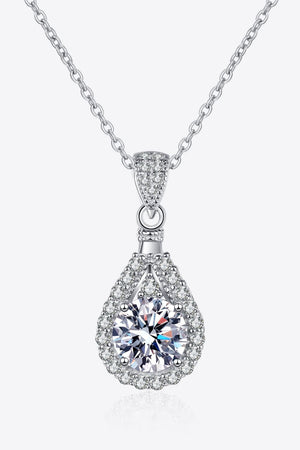 Silver teardrop moissanite necklace with halo detail on sterling silver chain.