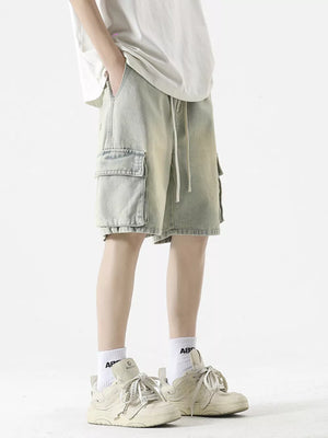 Light wash denim cargo shorts with drawstring waist and flap pockets.