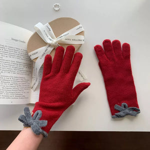Deep Red knit gloves with grey bow detail on cuff, cozy adult accessories.
