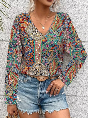 Bohemian paisley v-neck shirt in multicolor with long sleeves, styled with denim shorts.