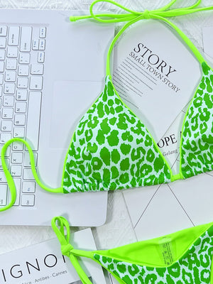 Green leopard print tie-side bikini set with neon green trim and ties.