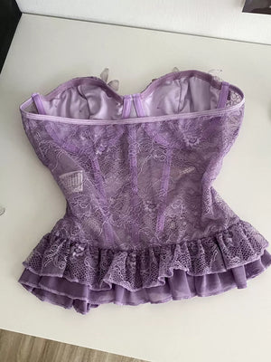 Purple lace bustier top with ruffled hem and butterfly appliques.