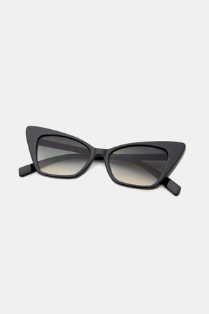 Black cat-eye sunglasses with sharp angular frames and gradient lenses