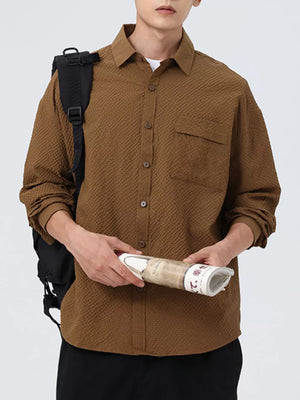 Textured oversized button-up shirt in coffee with a chest pocket and classic collar.