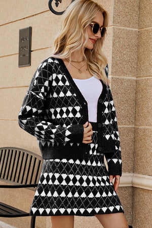Black argyle knit cardigan and mini skirt set with button front and V-neck.