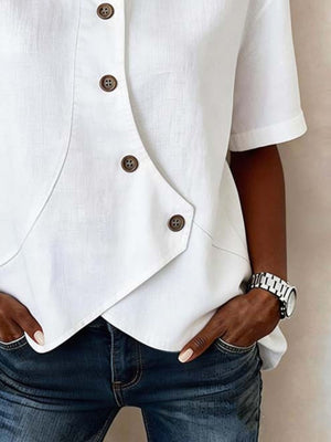 White asymmetrical button front shirt with diagonal placket detail.