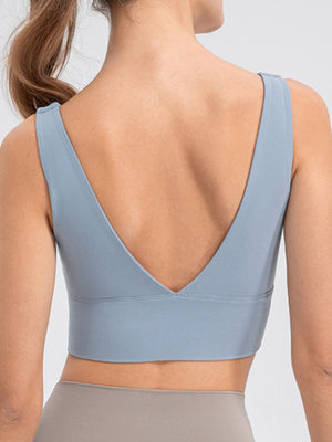 Light blue performance crop top with deep V-back and wide band