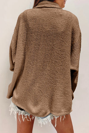 Camel textured corduroy overshirt with button front and patch pockets.