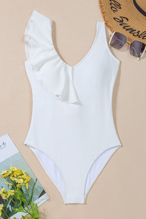 White textured one-piece swimsuit with a ruffled asymmetrical neckline and V-neck.