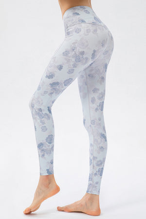 Light blue skinny leggings with a watercolor floral print