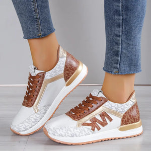 White and brown monogrammed runner sneakers with gold accents