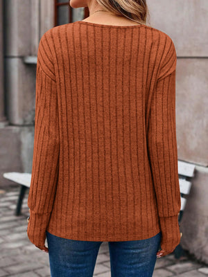 Caramel ribbed knit V-neck sweater with button cuffs, casual long sleeves.