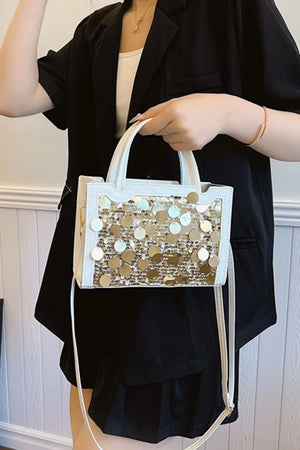 White structured mini bag with gold sequin embellishments and top handles
