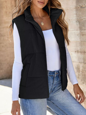 Black ribbed corduroy zip-up vest with stand collar and pockets.