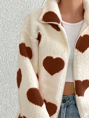 Heart print sherpa zip-up jacket in cream with brown hearts, featuring a collared neckline.