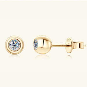 Gold bezel-set crystal stud earrings with a D color grade diamond.