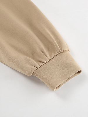 Camel quarter zip top sleeve detail with ribbed cuff and gathered fabric