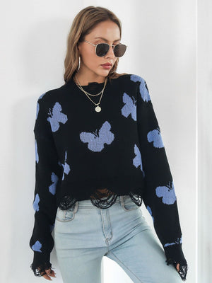 Black cropped knit sweater with distressed butterfly print and frayed hem.