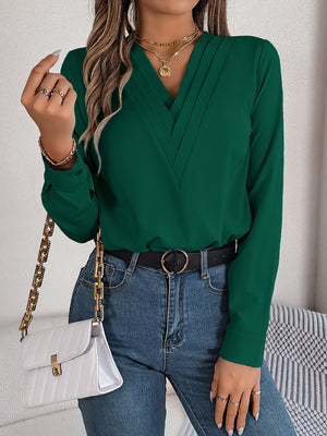 Dark Green V-neckline blouse with subtle pleats and long sleeves.