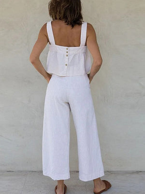 White linen crop top with button back and wide leg culottes.