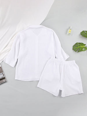 White gauze cotton resort shirt and shorts set with buttoned front and elastic waist.