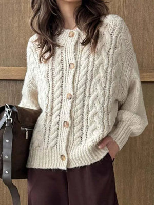 Ivory cable-knit button-down cardigan with wooden buttons.