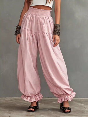 Full Size Smocked Ruffle Hem Wide Leg Pants in Mustard, model styling view