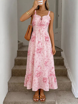 Pink floral cami midi dress with tie front and ruffled hem.