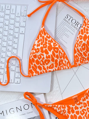 Tangerine leopard print tie-side bikini set with adjustable straps.