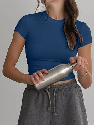 Blue crew neck cropped t-shirt with short sleeves.