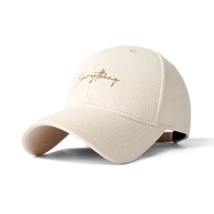 Rice white cotton baseball cap with cursive embroidery and curved brim.