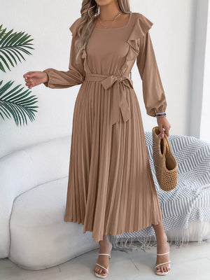 Khaki A-line midi dress with ruffles, tie waist, and pleated skirt.