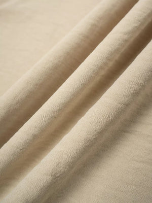 Tan relaxed wide-leg maternity pants with a textured fabric detail.