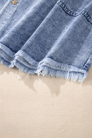 Acid wash denim shirtdress in medium with raw hem detail and button closure.
