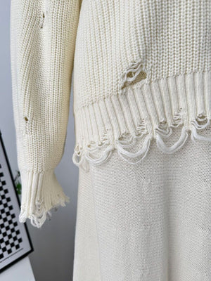 Off white distressed cotton sweater set with deconstructed hem and sleeve details.