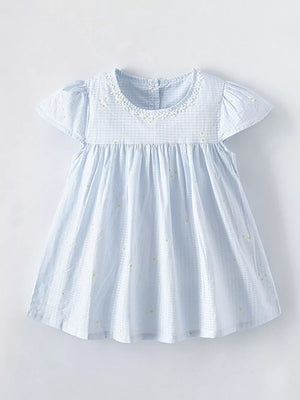Baby dress in light blue gingham with yellow dots, cap sleeves, and lace collar.