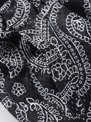 Black paisley mesh basketball shorts with a pocket detail.