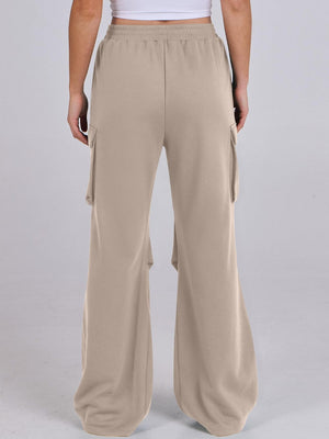 Tan sweatpants with cargo pockets and a wide leg silhouette.