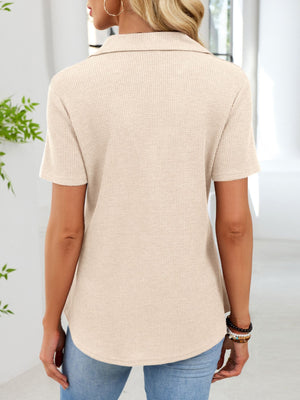 Apricot waffle knit button placket t-shirt with collared neckline and short sleeves.