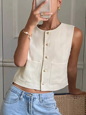 Cream cotton crew neck sleeveless vest with gold buttons and chest pockets