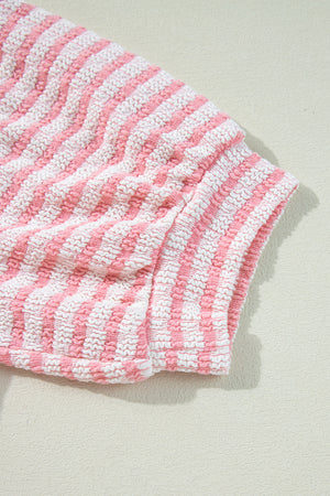 Textured stripe puff sleeve top in blush pink with a seersucker fabric detail.
