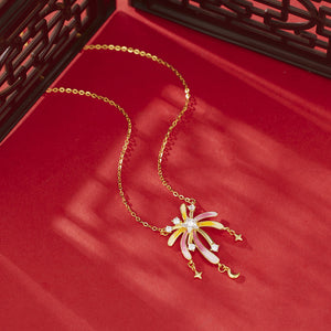 18k gold Starburst pendant necklace with colorful enamel and cubic zirconia accents, featuring dangling stars and moon