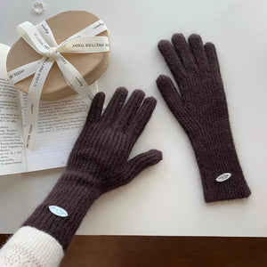 Luxurious ribbed knit touchscreen gloves in coffee brown with a small oval logo detail.