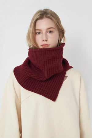 Burgundy ribbed knit neck warmer with extended panel, worn by a model.