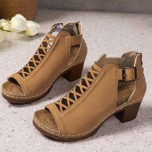 Khaki criss-cross cut-out block heel sandals with ankle strap and buckle detail.