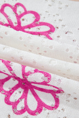 White eyelet knit pullover with floral embroidery detail